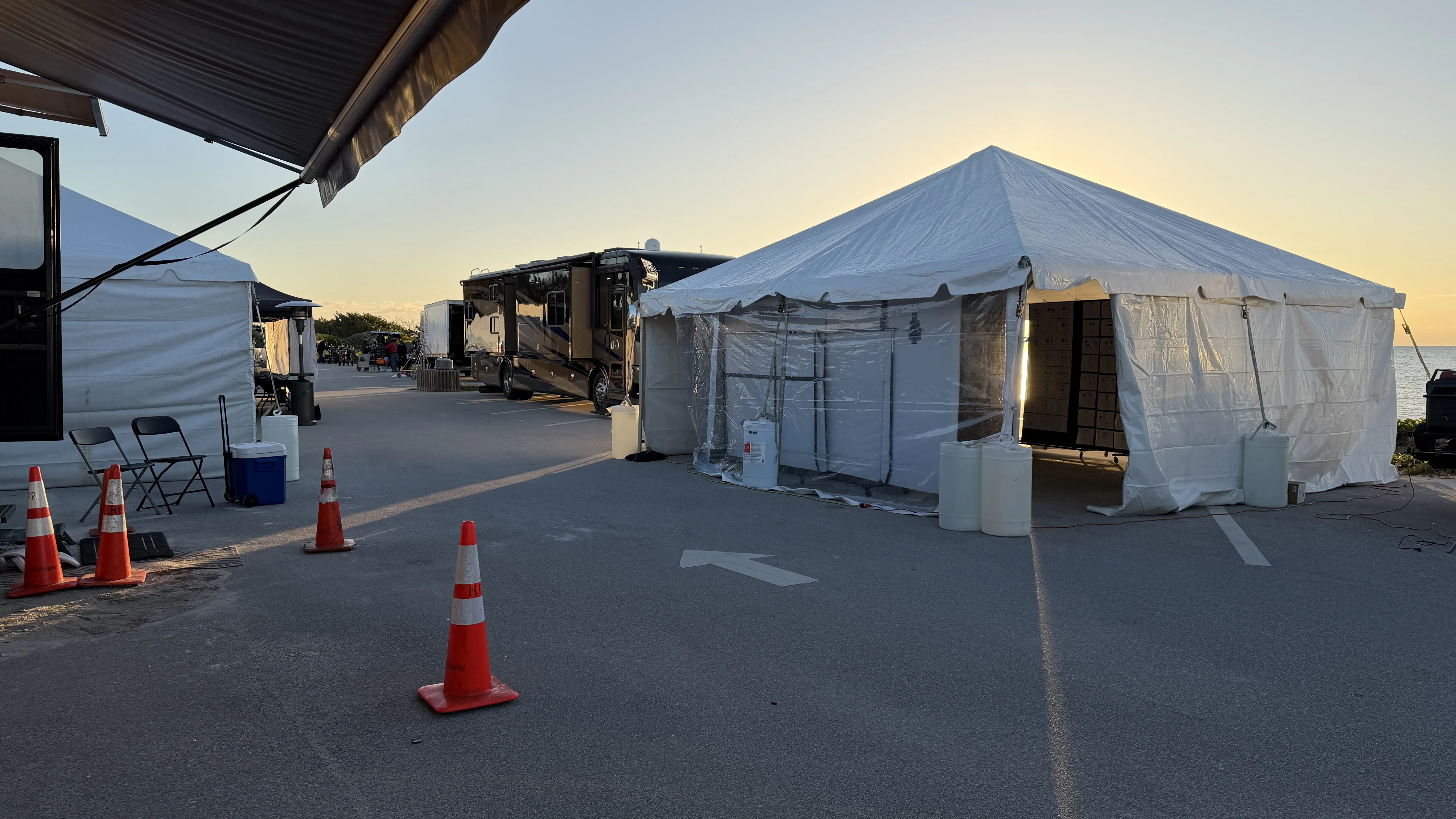 Production tents and trailers at golden hour
